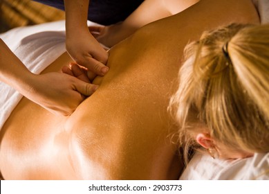 Woman At A Day Spa Getting A Deep Tissue Massage