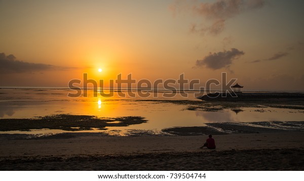 Woman in deep
thought - watching the beautiful Sunrise - woman resting after the
workout - enjoying her
holiday