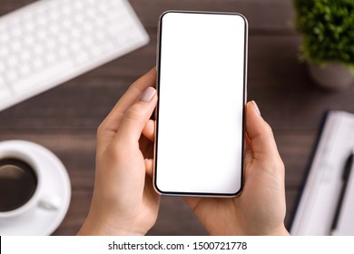 Woman demonstrating new modern smartphone with blank white screen for advertisement or application mockup