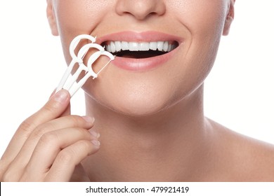 Woman And Dental Floss Pick On White Background