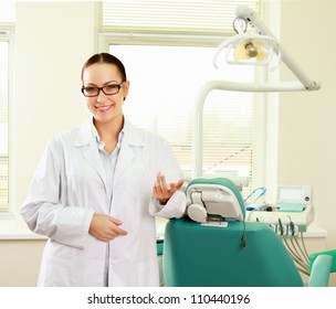 Woman Dentist At Her Office Smiling