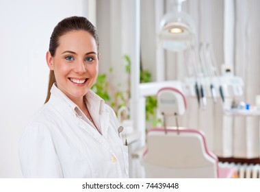 Woman Dentist At Her Office Smiling