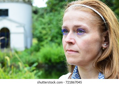woman depressed in park - Shutterstock ID 721867045