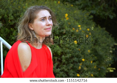 Similar – Young pretty woman in a pink blazer stands in front of an orange wall