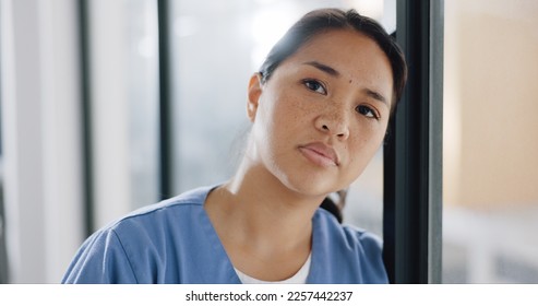 Woman, depression and sad nurse in hospital after loss, failure or bad news. Stressed, mental health and face of unhappy, depressed and thinking female medical professional with burnout and anxiety. - Powered by Shutterstock