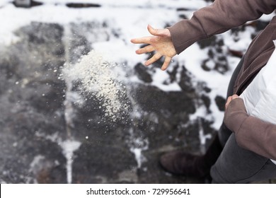 Woman Descends Her Stairs In Front Of Home With Salt Grit