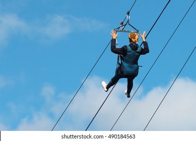 Woman Descends On A Zipline