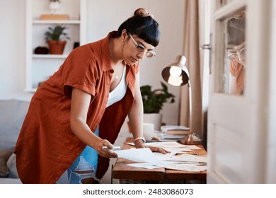 Woman, design and sketch or drawing at desk for creativity, small business and designer or art in home. Seamstress, dressmaker and planning in apartment for mood board or project for fashion week - Powered by Shutterstock