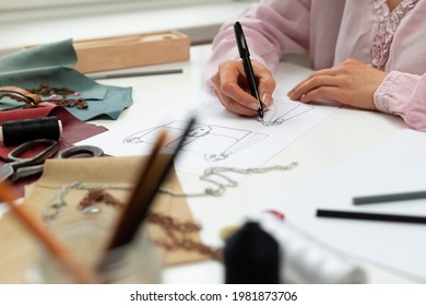 Woman Designer Draws A Sketch Of A Handbag.