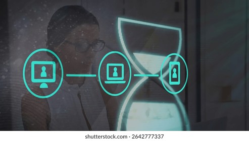Woman at desk wearing glasses and blouse using interface overlay, with device icons, neon hourglass. Technology, innovation, digital, productivity, futurism, touchscreen, interface
