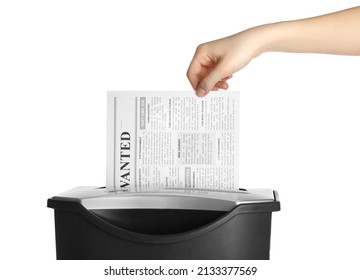 Woman Destroying Newspaper With Paper Shredder On White Background, Closeup