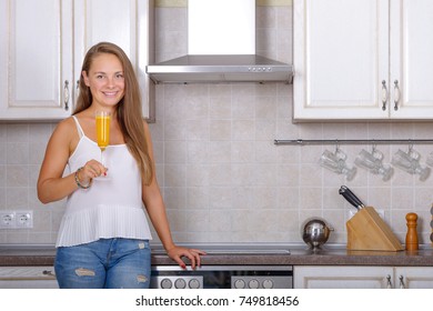 Woman With Detox Drink From Turmeric In Kitchen Room