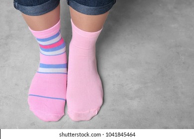 Woman In Different Socks Indoors