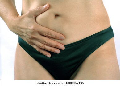 Woman With Digestion Problem Holding Her Stomach Close Up