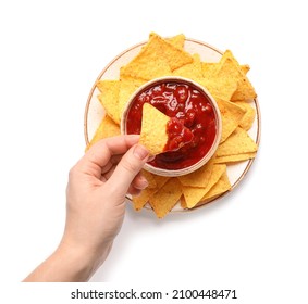 Woman dipping nachos into tasty salsa sauce - Powered by Shutterstock