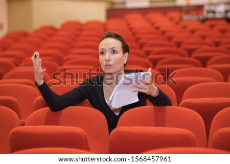 woman directing in a theater