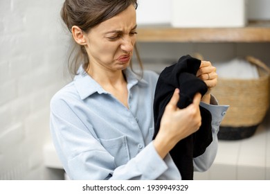 Woman With A Dirty Cloth In Laundry