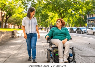 Woman with disability using electric wheelchair and chinese friend talking while walking along the city - Powered by Shutterstock