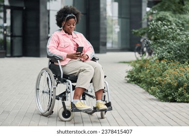 Woman with disability using smartphone outdoors - Powered by Shutterstock