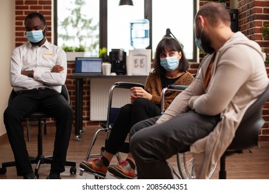 Woman With Disability Wearing Face Mask At Group Therapy Session, During Pandemic. People With Alcohol Addiction Attending Aa Meeting Program To Receive Mental Health Help From Psychotherapist.