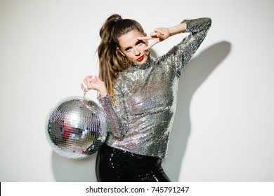 Woman with disco ball
