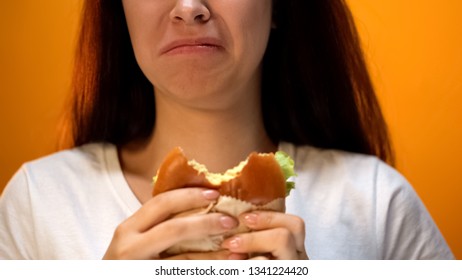 Woman Dissatisfied With Unappetizing Hamburger, Low Food Quality, Closeup