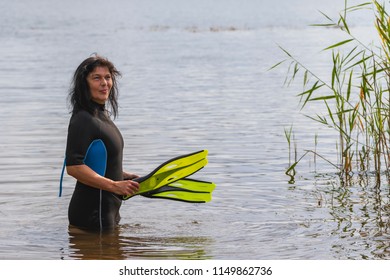 Woman With Diving Fins And Wetsuit 