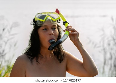 Woman With Diving Goggles And Snorkel