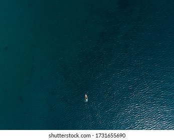 Woman In The Diving Suit On The Sup Board