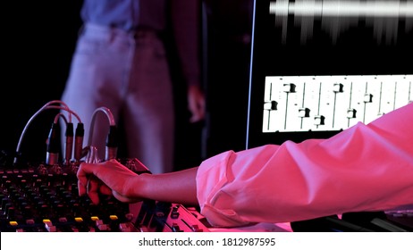 Woman DJ and sound designer enjoy the music in her track recording. Woman listing music and adjustments playback wearing headphones. Concept sound engineer working In studio - Powered by Shutterstock