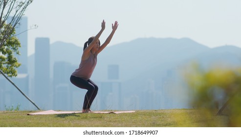 Woman Do Yoga At Outdoor City