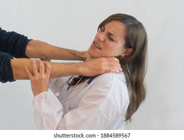 Woman Doctor Attacked With Choking Grip. Concept Of Violence And Aggression On Doctors And Healthcare Professionals.