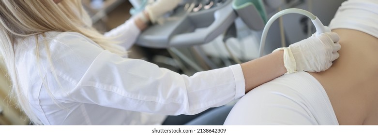 Woman Doctor Doing Kidney Ultrasound Examination In Clinic