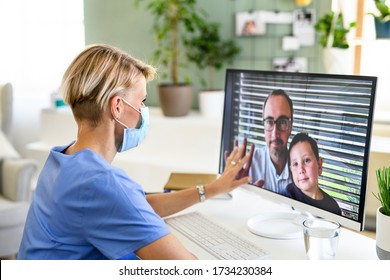 Woman Doctor Having Video Call With Husband And Son, Social Distancing Concept.