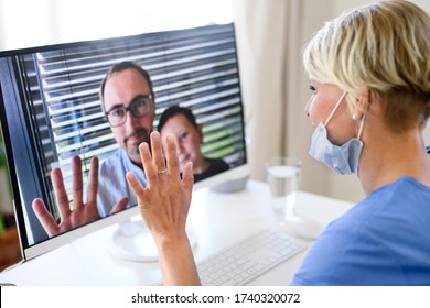Woman Doctor Having Video Call With Husband And Son On Laptop.