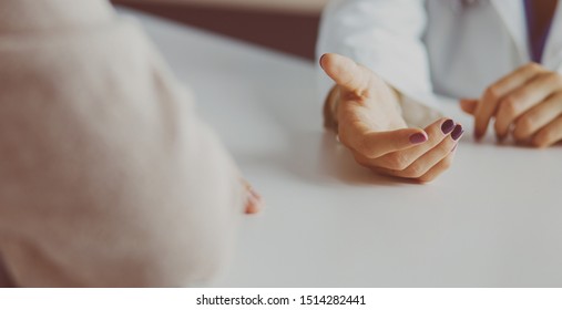 Woman doctor helping senior holding hand in hospital - Shutterstock ID 1514282441