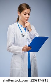 Woman Doctor Holding Clipboard And Reading Medical History. Isolated Female Portrait.