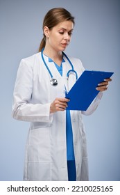 Woman Doctor Holding Clipboard And Reading Medical History. Isolated Female Portrait.