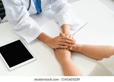 Woman Doctor Holds Cancer Patient Hands To Make Her Happy.