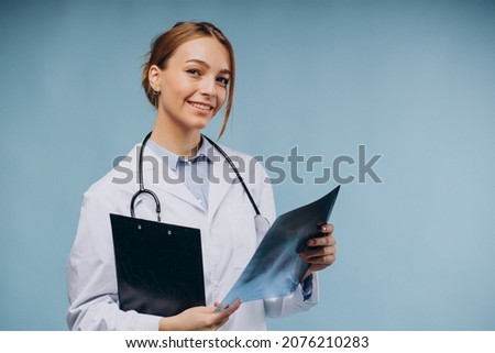 Woman doctor looking at xray picture