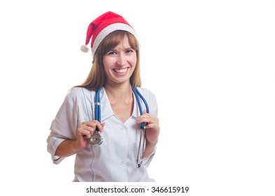 The Woman The Doctor In A New Year's Cap And A White Dressing Gown Laughs. New Year. Christmas.