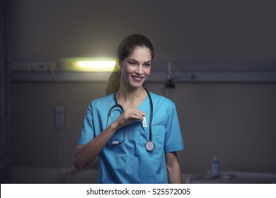 Woman Doctor Or Nurse Is Feeling Satisfied While Working Night Shift At The Hospital