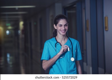 woman doctor or nurse is feeling satisfied while working night shift at the hospital - Shutterstock ID 525572029