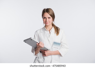 Woman Doctor With Papers And Laptop Isolated On The White