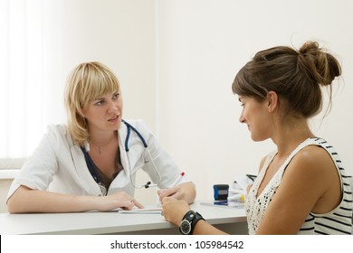 Woman Doctor And Patient In Clinic