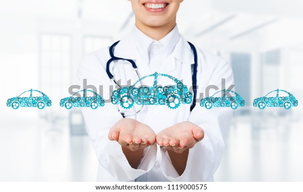 Woman doctor presenting in palms concept of car\
transporation or\
insurance