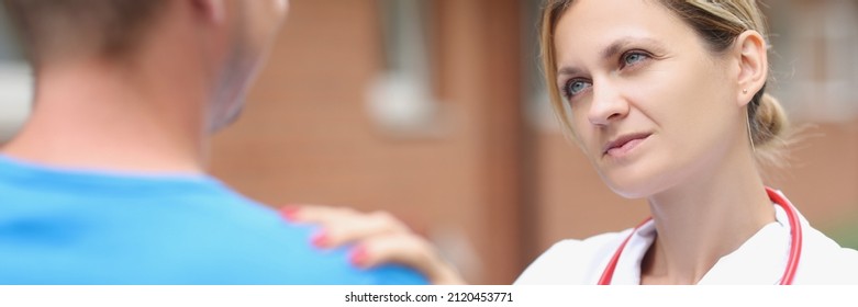 Woman Doctor Putting Hand On Patient Shoulder To Calm Down. Psychological Support For Terminally Ill Patients Concept