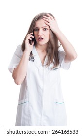 Woman Doctor Reveiving Bad News On The Phone. Concerned Female Medic Concept On White Background