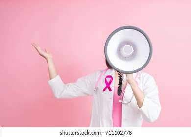 woman doctor show something with chest health concept on pink background