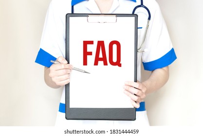 Woman Doctor Showing Paper Plate With Text FAQ With Marker, Medical Concept